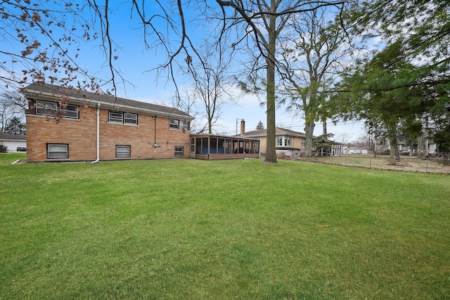 view of yard with a sunroom