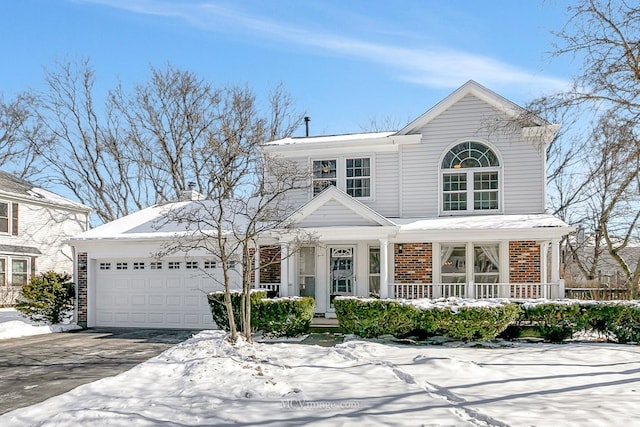 view of front of home featuring driveway, brick siding, and an attached garage