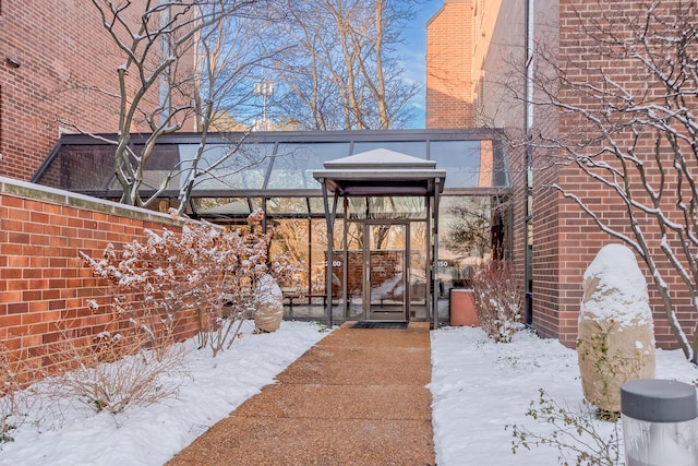 exterior space with brick siding and fence