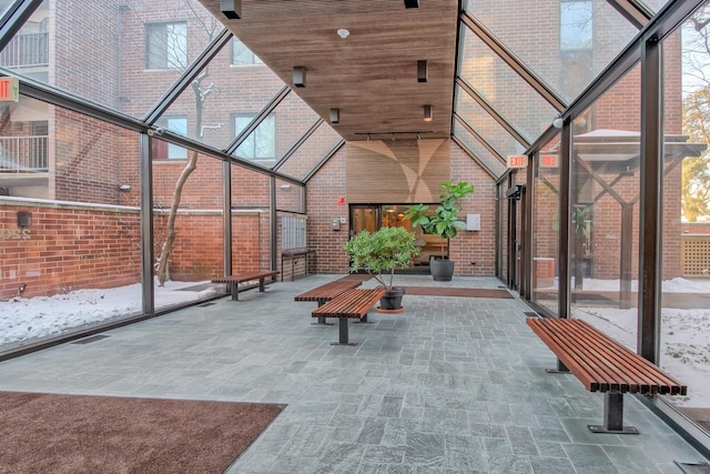 unfurnished sunroom featuring wood ceiling