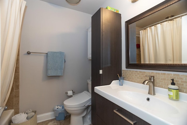 bathroom with baseboards, decorative backsplash, toilet, curtained shower, and vanity