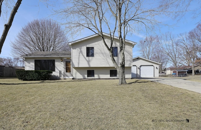 split level home featuring a garage, driveway, a front lawn, and fence