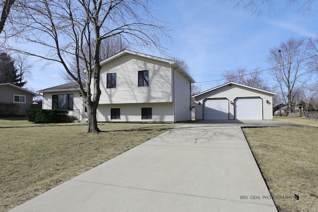 split level home featuring an outbuilding, a front lawn, and a garage