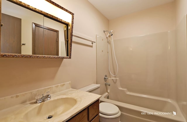 bathroom featuring vanity, toilet, and shower / bath combination