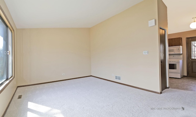 carpeted empty room with visible vents and baseboards