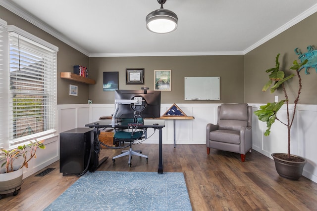 office with a wainscoted wall, visible vents, wood finished floors, and ornamental molding