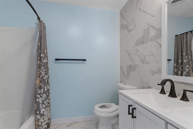 bathroom with marble finish floor, tile walls, shower / bathtub combination with curtain, toilet, and vanity