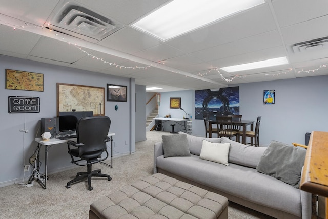 office with carpet floors, a drop ceiling, visible vents, and baseboards