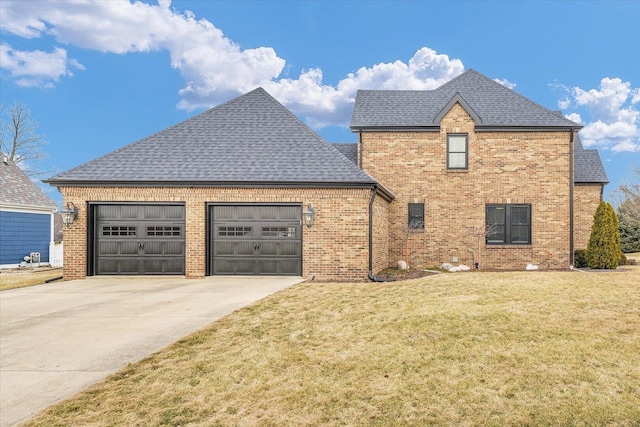 view of front of home featuring driveway, brick siding, a front lawn, and an attached garage