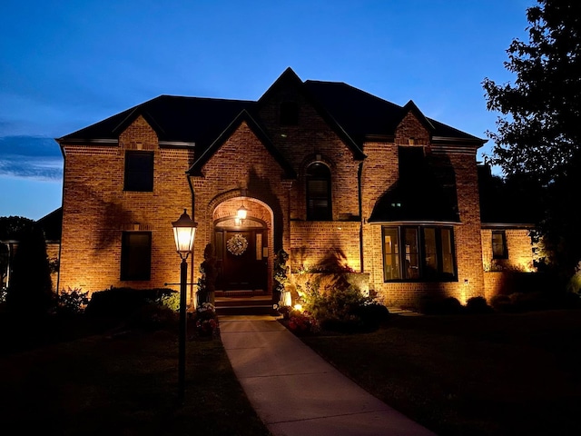 view of front facade featuring brick siding