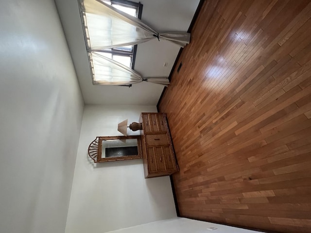 unfurnished bedroom with wood walls