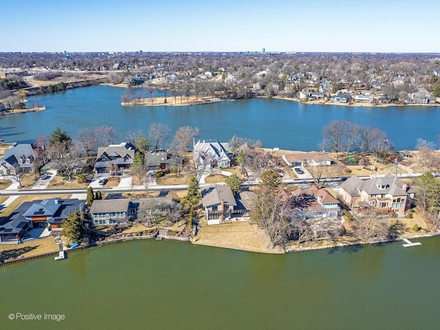 birds eye view of property with a residential view and a water view