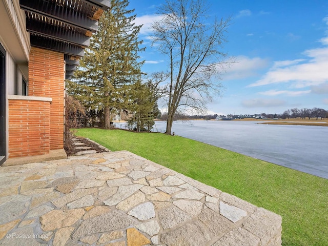 view of patio / terrace with a water view