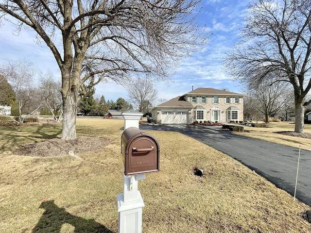 view of front facade featuring a garage and a front yard