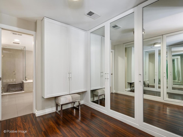 spacious closet with visible vents and wood finished floors