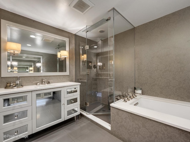 bathroom featuring visible vents, a shower stall, vanity, tile patterned flooring, and a bath