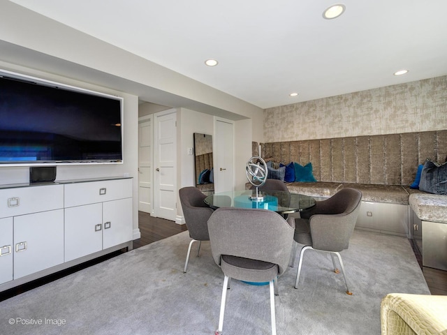 unfurnished dining area with wallpapered walls, wood finished floors, and recessed lighting