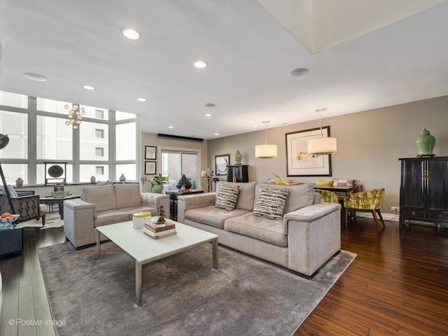 living room featuring dark wood-style floors, baseboards, and recessed lighting