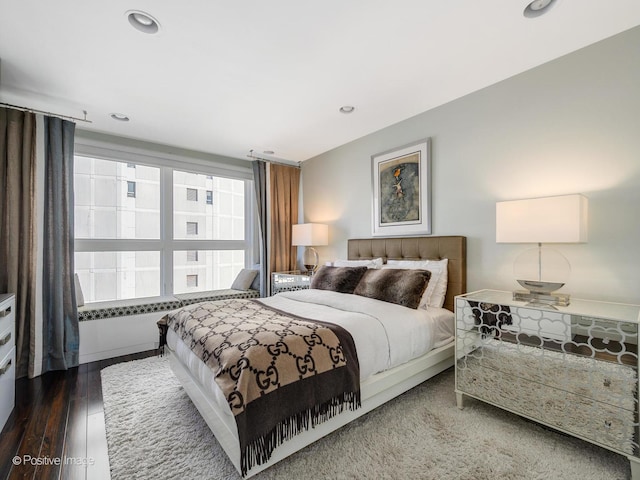 bedroom featuring recessed lighting and wood finished floors