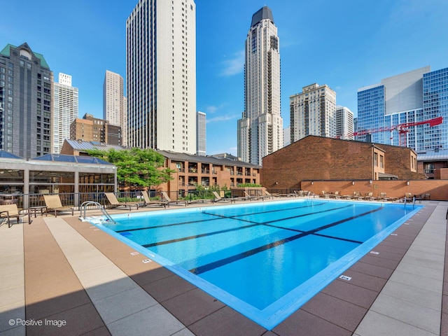 community pool featuring a view of city