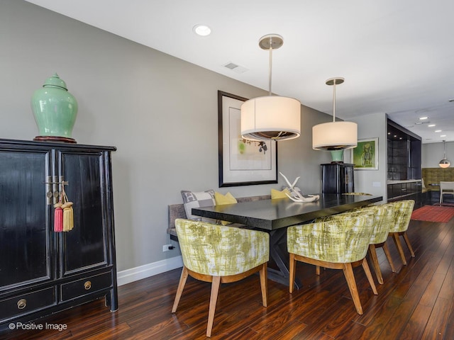 dining room featuring recessed lighting, visible vents, baseboards, and wood finished floors