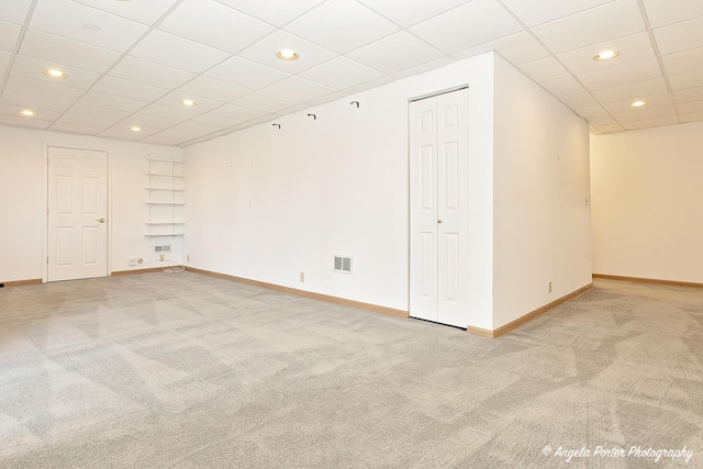 spare room with recessed lighting, baseboards, visible vents, and light carpet