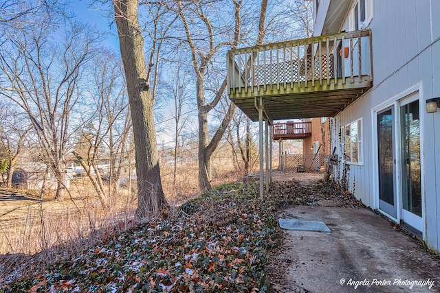 view of yard with a wooden deck