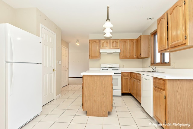 kitchen with white appliances, light tile patterned floors, a sink, under cabinet range hood, and a center island