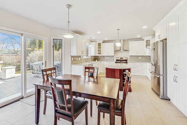 dining room featuring recessed lighting