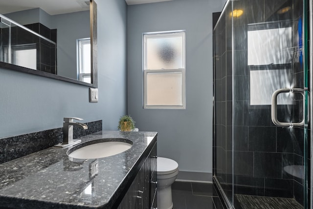 full bath featuring toilet, a stall shower, tile patterned floors, and vanity