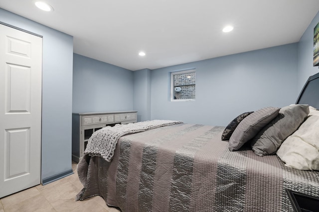 bedroom with recessed lighting and light tile patterned flooring