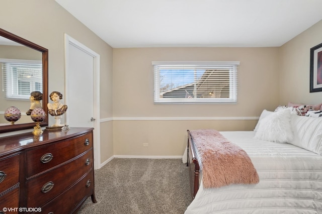 bedroom featuring light carpet and baseboards