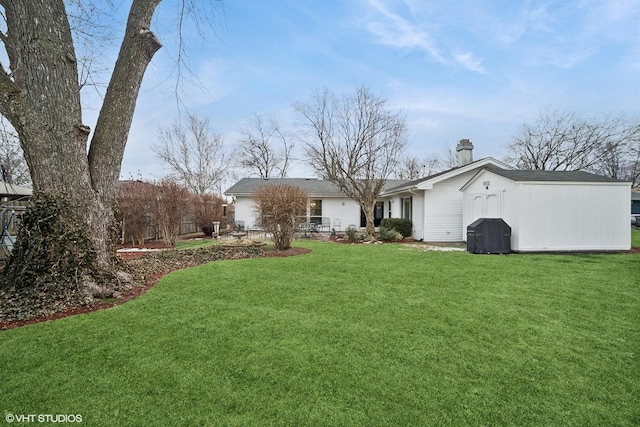 view of front of property featuring a garage and a front lawn