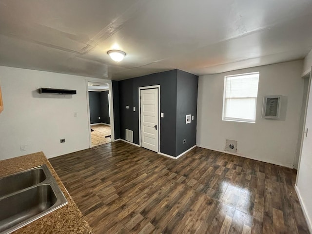 interior space featuring a sink and wood finished floors