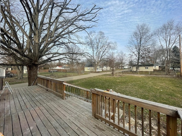 wooden terrace with a yard