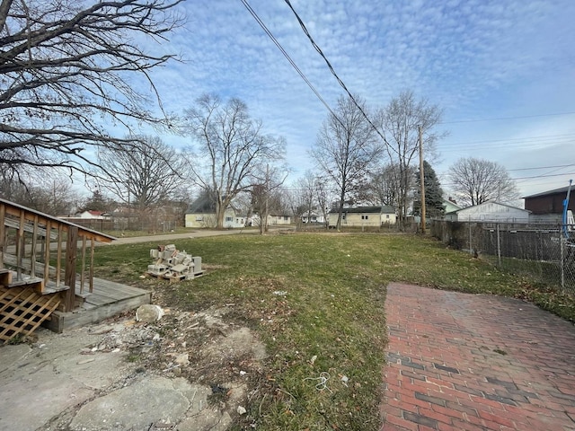 view of yard with fence and a wooden deck