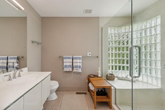 full bathroom with tile patterned flooring, toilet, vanity, visible vents, and an enclosed shower