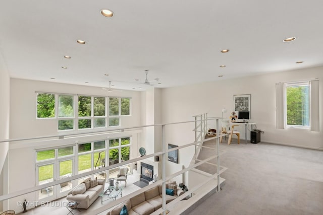 living room with recessed lighting and carpet flooring