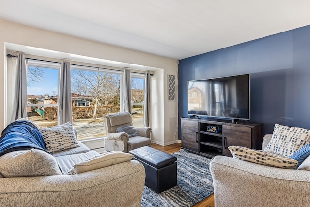 living room featuring baseboards and wood finished floors