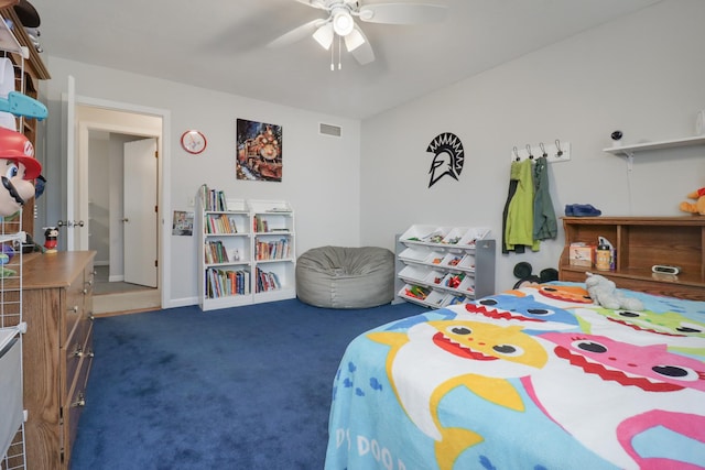 bedroom with dark colored carpet, visible vents, and ceiling fan