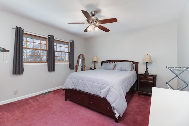 bedroom with ceiling fan, carpet floors, visible vents, and baseboards