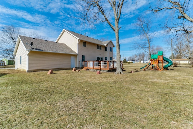 view of yard featuring a deck and a playground