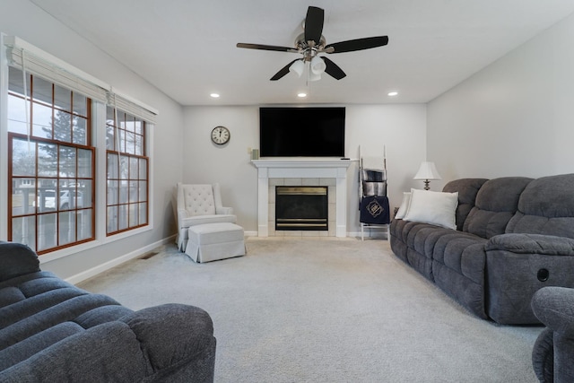 living room with recessed lighting, light carpet, a fireplace, and baseboards