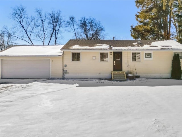 single story home featuring a garage