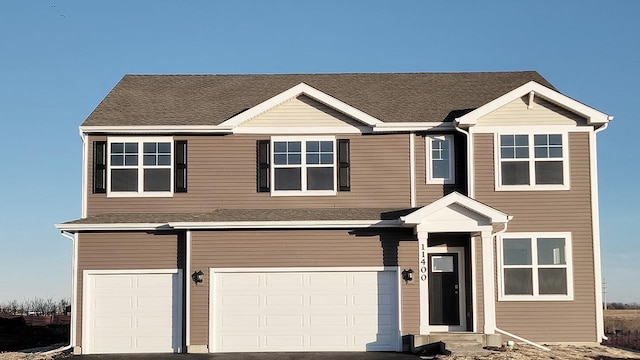 view of front of property with a garage