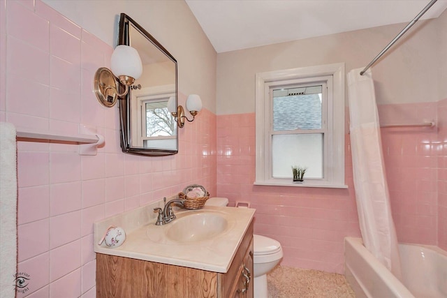 full bathroom with shower / bathtub combination with curtain, tile walls, toilet, and vanity