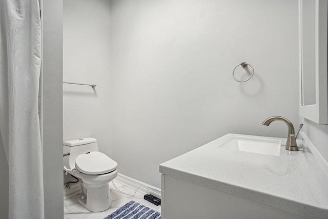 full bathroom with marble finish floor, baseboards, vanity, and toilet