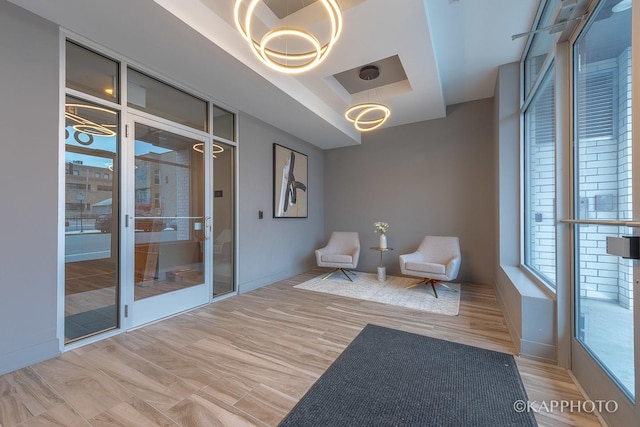 sitting room with wood finished floors and baseboards