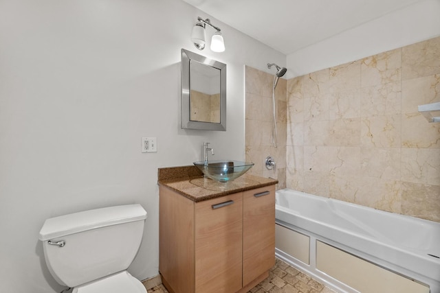 bathroom with toilet, shower / tub combination, and vanity