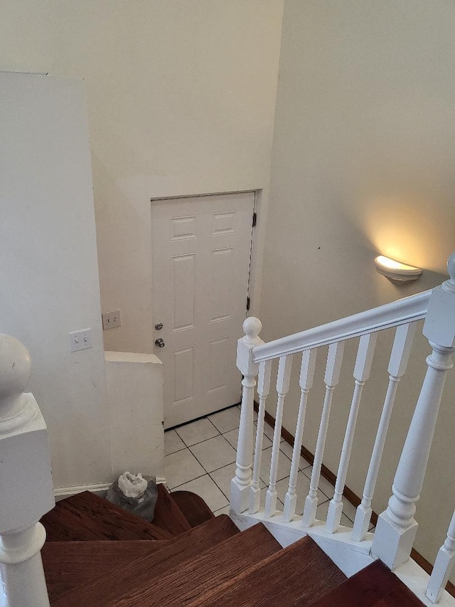 stairway featuring tile patterned floors